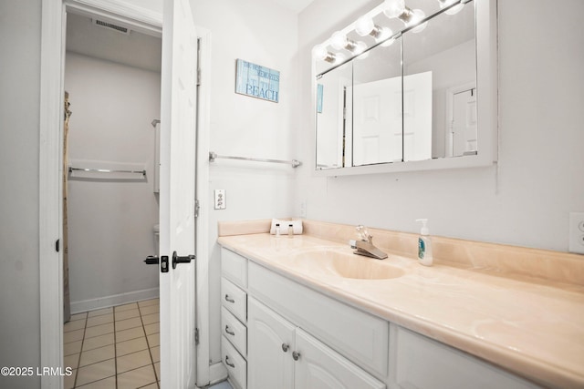 bathroom with visible vents, tile patterned flooring, and vanity