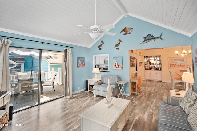 living area with baseboards, beam ceiling, light wood finished floors, high vaulted ceiling, and ceiling fan with notable chandelier
