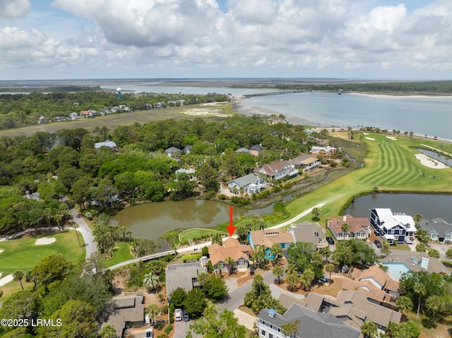 aerial view with a residential view, a water view, and view of golf course