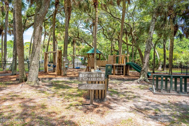 view of yard with playground community and fence