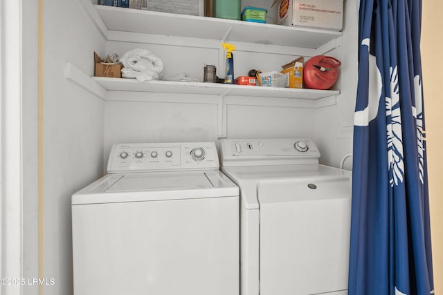 washroom featuring independent washer and dryer and laundry area