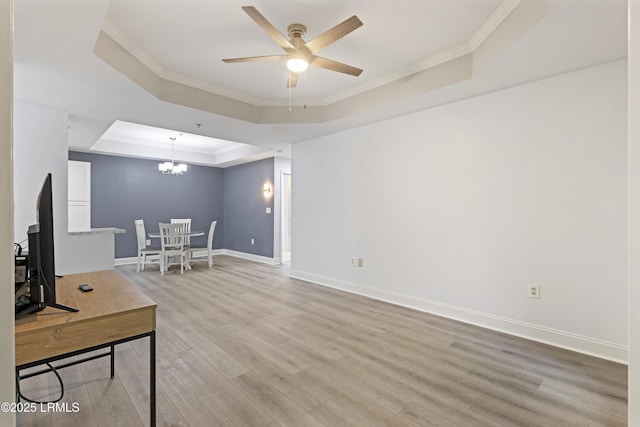 4924 Bluffton Pkwy Unit 18-106, Bluffton, SC 29910 - living area featuring a raised ceiling, ceiling fan, light wood-style floors, crown molding, and baseboards