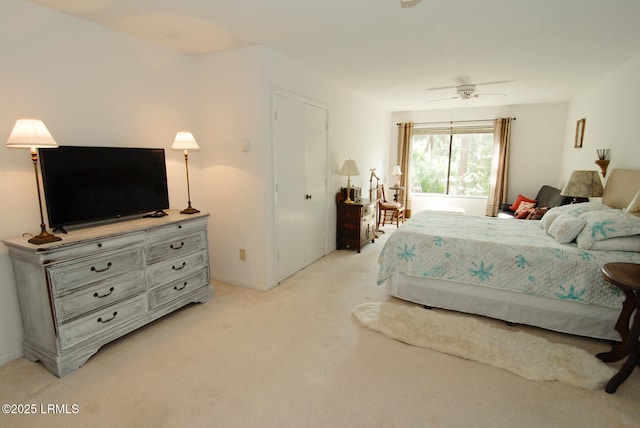bedroom with light colored carpet and ceiling fan