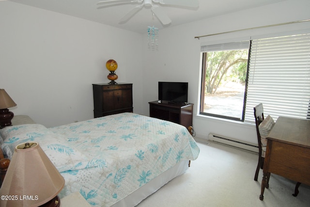 carpeted bedroom featuring ceiling fan and baseboard heating