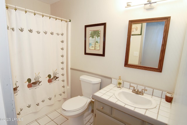 full bath with vanity, tile patterned floors, wallpapered walls, and toilet