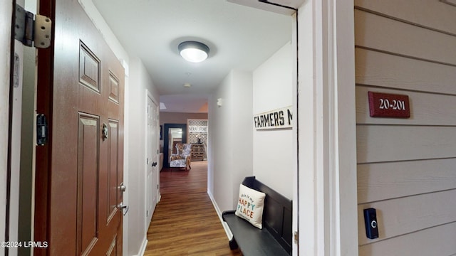 corridor with hardwood / wood-style flooring