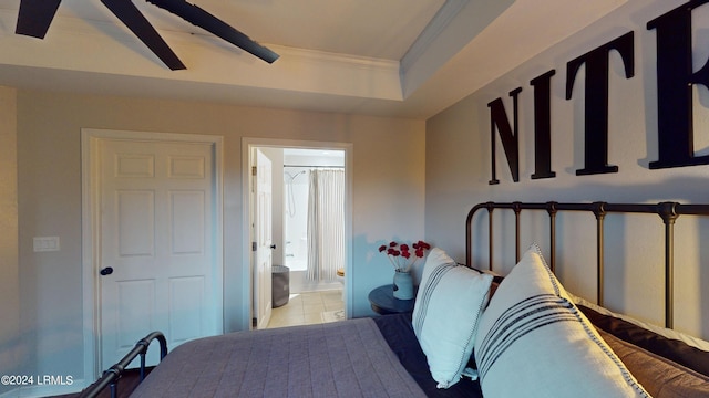 bedroom featuring ensuite bath, ornamental molding, and ceiling fan