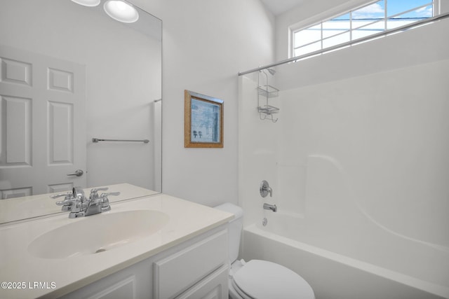 full bathroom with shower / tub combination, vanity, and toilet