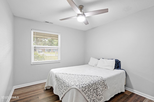 4018 Shell Point Rd, Beaufort, SC 29906 - bedroom with dark wood-type flooring, baseboards, and ceiling fan
