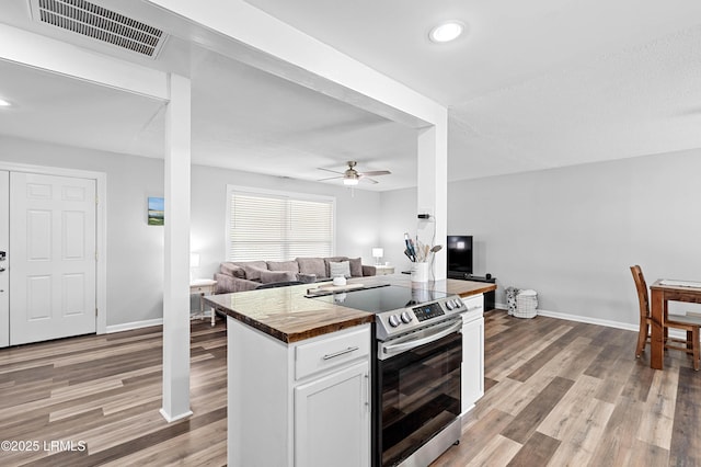 4018 Shell Point Rd, Beaufort, SC 29906 - kitchen featuring butcher block counters, stainless steel electric range oven, ceiling fan, open floor plan, and white cabinets