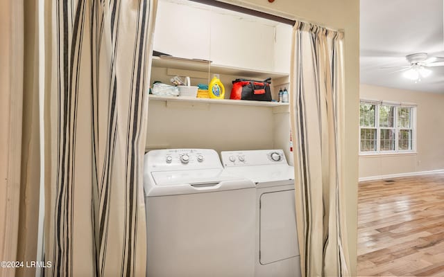 washroom featuring independent washer and dryer, ceiling fan, and light wood-type flooring