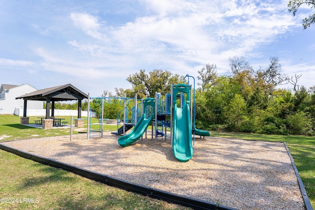 view of playground with a gazebo and a lawn