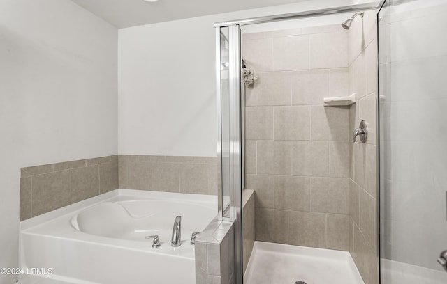 bathroom with independent shower and bath