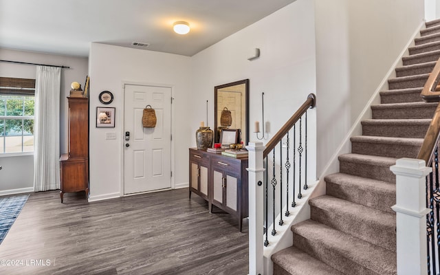 entrance foyer featuring dark hardwood / wood-style flooring