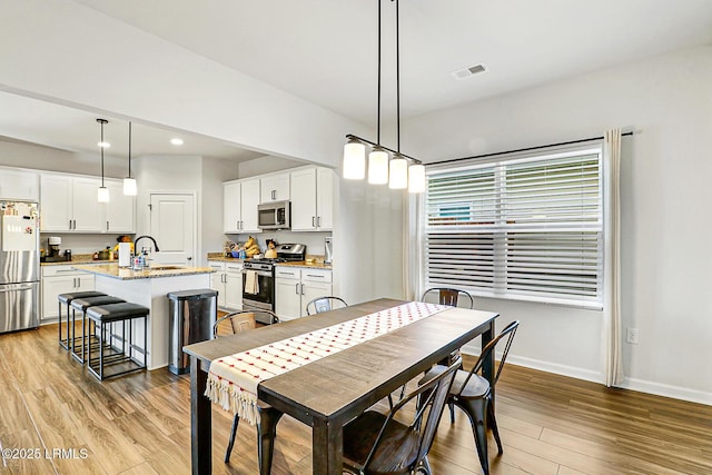 32 Chinquapin St, Beaufort, SC 29906 - dining room with recessed lighting, visible vents, light wood finished floors, and baseboards