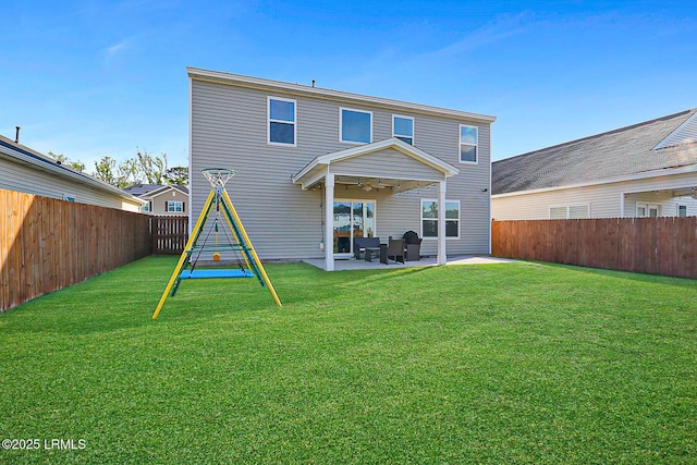 32 Chinquapin St, Beaufort, SC 29906 - rear view of house with a fenced backyard, a ceiling fan, a patio, and a lawn