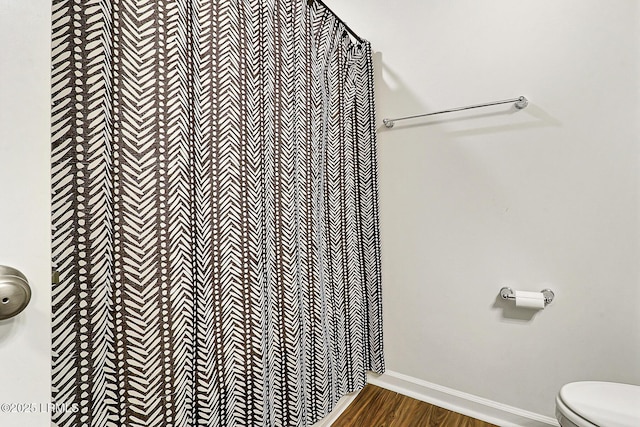 32 Chinquapin St, Beaufort, SC 29906 - bathroom with baseboards, wood finished floors, and toilet