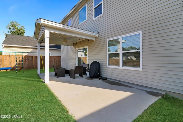 32 Chinquapin St, Beaufort, SC 29906 - back of house with fence, a patio area, a lawn, and a ceiling fan