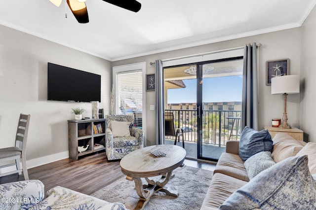 living room featuring crown molding, ceiling fan, and dark hardwood / wood-style flooring