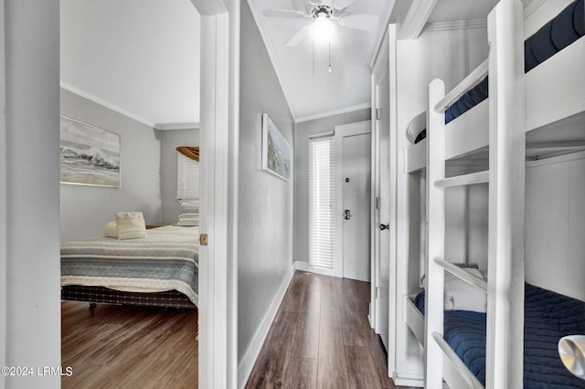 hall with hardwood / wood-style flooring and ornamental molding