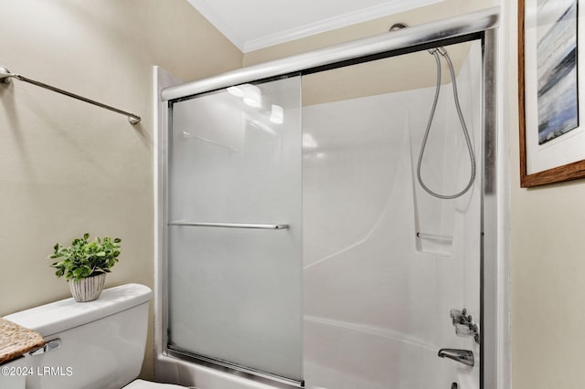 bathroom with ornamental molding, bath / shower combo with glass door, and toilet