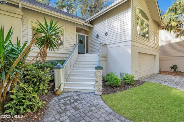 view of exterior entry featuring a garage