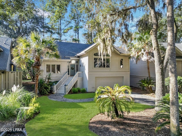 view of front facade featuring a garage and a front lawn