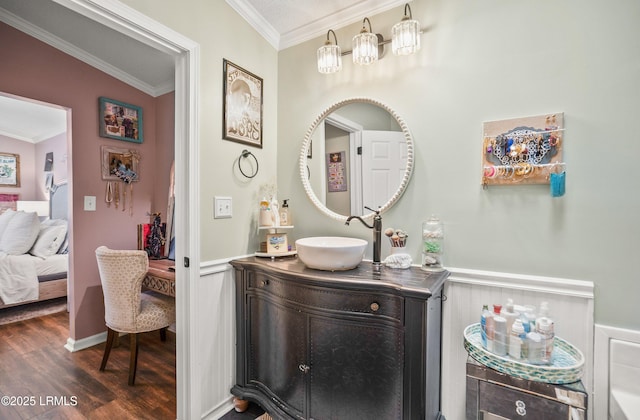 10 Rockville Way, Beaufort, SC 29902 - ensuite bathroom featuring ornamental molding, wood finished floors, vanity, and a wainscoted wall