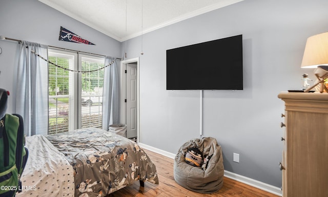 10 Rockville Way, Beaufort, SC 29902 - bedroom with crown molding, wood finished floors, vaulted ceiling, and a textured ceiling