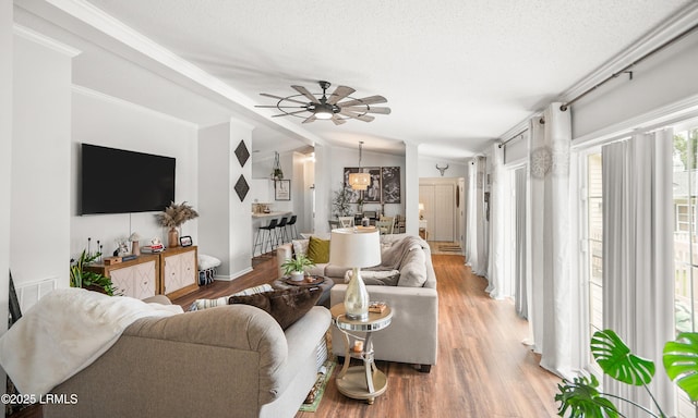 10 Rockville Way, Beaufort, SC 29902 - living room featuring lofted ceiling, light wood-type flooring, ceiling fan, and crown molding