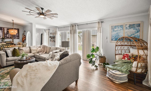 10 Rockville Way, Beaufort, SC 29902 - living room with ornamental molding, a textured ceiling, wood finished floors, a ceiling fan, and arched walkways