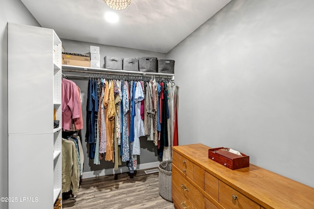 spacious closet with wood finished floors