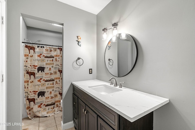 full bathroom featuring curtained shower, tile patterned flooring, and vanity