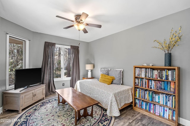 bedroom with ceiling fan and wood finished floors