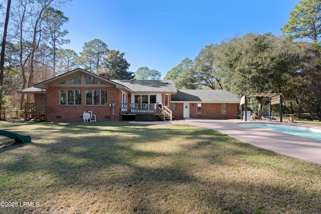 view of front facade featuring brick siding, crawl space, a deck, an outdoor pool, and a front lawn