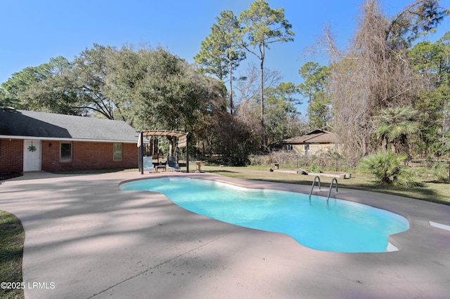 outdoor pool featuring fence, a pergola, and a patio