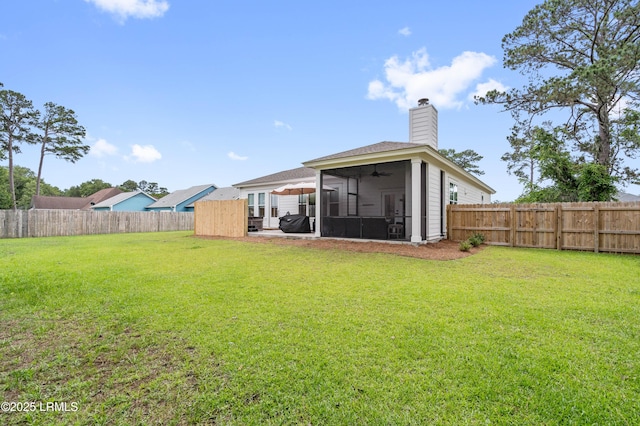 1014 Ferrets End, Beaufort, SC 29902 - rear view of house with a sunroom, a chimney, and a ceiling fan
