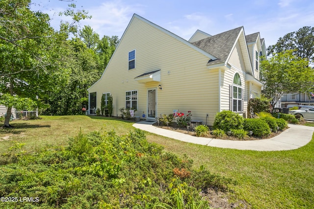 504 Candida Dr, Beaufort, SC 29906 - back of property featuring roof with shingles and a lawn