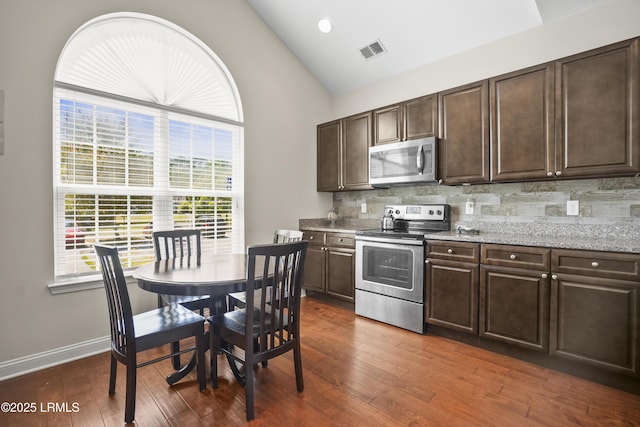 504 Candida Dr, Beaufort, SC 29906 - kitchen featuring visible vents, plenty of natural light, dark brown cabinetry, and stainless steel appliances