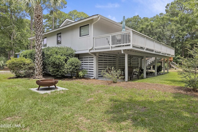 8 Bradley Beach Rd, Hilton Head Island, SC 29928 - back of property with stairway, a wooden deck, and a yard