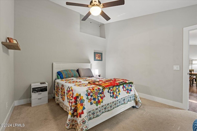 bedroom with light carpet and ceiling fan