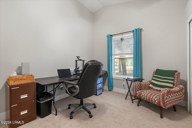 carpeted office featuring vaulted ceiling and plenty of natural light