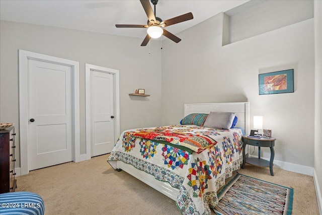 carpeted bedroom with lofted ceiling and ceiling fan