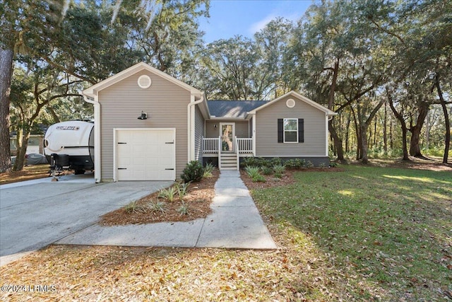 view of front of house featuring a garage and a front lawn