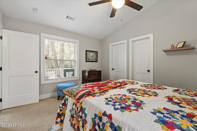 carpeted bedroom featuring lofted ceiling and ceiling fan