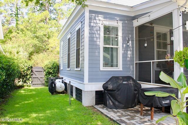 10 Hayek St, Beaufort, SC 29907 - view of property exterior with a lawn