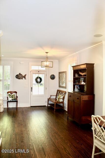 10 Hayek St, Beaufort, SC 29907 - entrance foyer featuring ornamental molding, dark wood finished floors, and a chandelier
