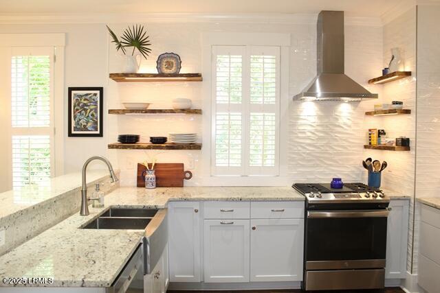 10 Hayek St, Beaufort, SC 29907 - kitchen featuring wall chimney exhaust hood, appliances with stainless steel finishes, open shelves, ornamental molding, and decorative backsplash
