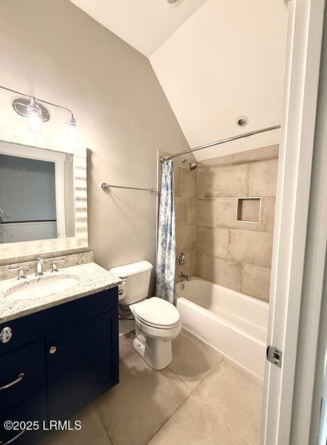 10 Hayek St, Beaufort, SC 29907 - bathroom with tile patterned floors, lofted ceiling, vanity, and shower / bath combination with curtain