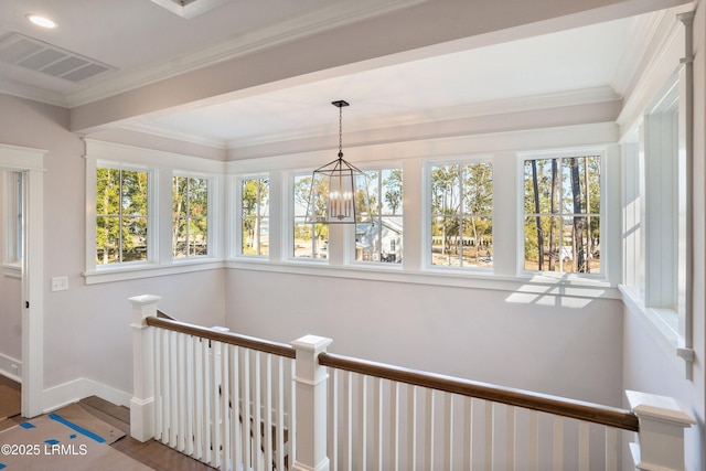 unfurnished sunroom with an inviting chandelier